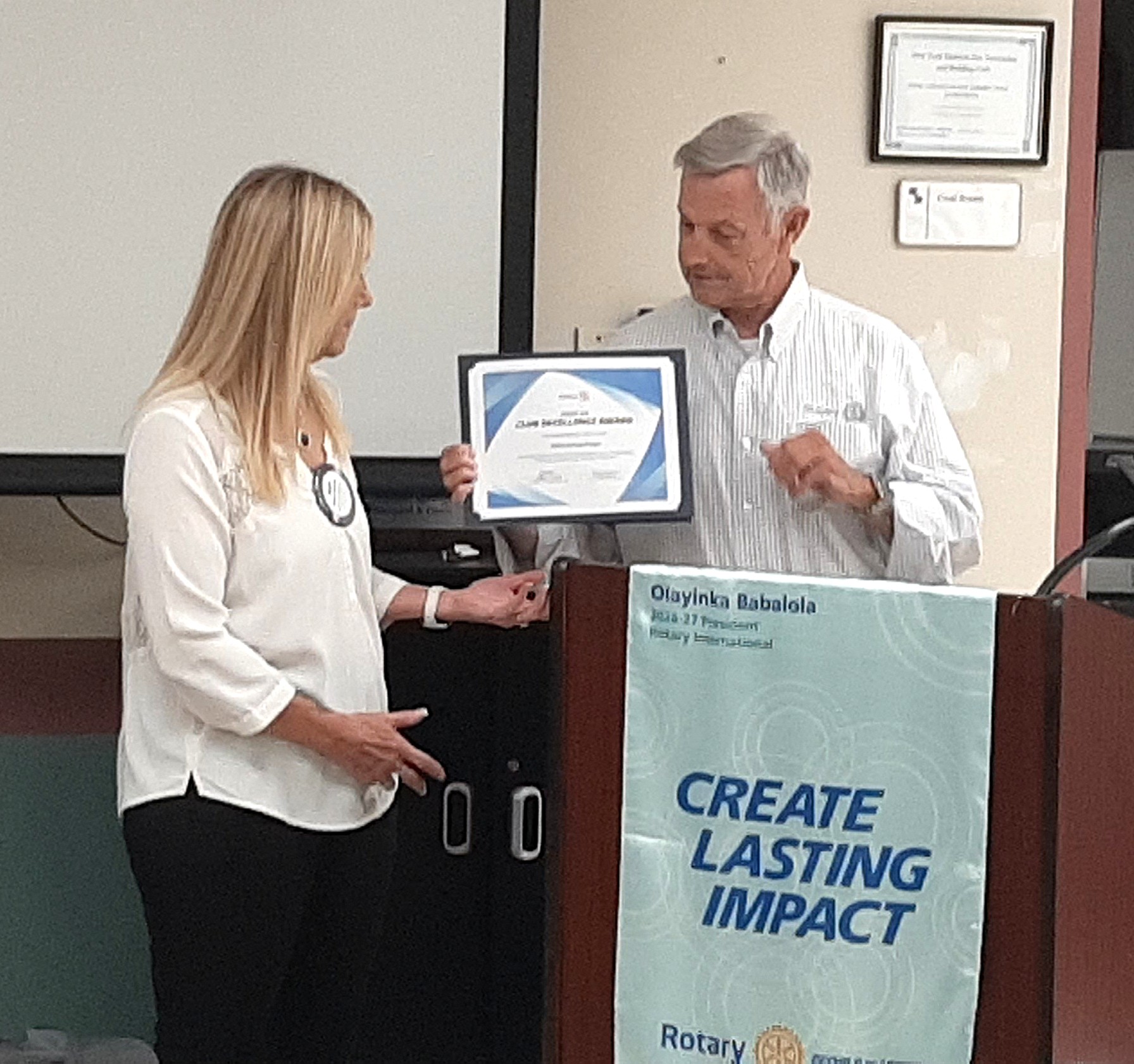 President Mary receiving the Club Excellence Award