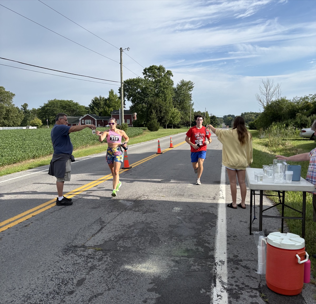 Club members providing water to runners at the Sauerkraut Festival
