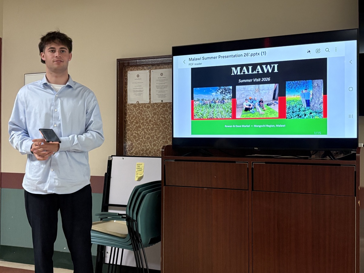 Rowan explaining the work at Malawi Children's Village