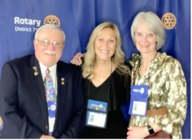 Three club members at the Rotary District 7120 conference